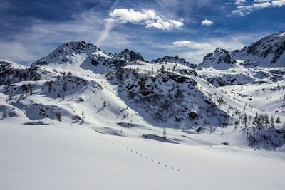 Scenic view of snowcapped mountains against sky