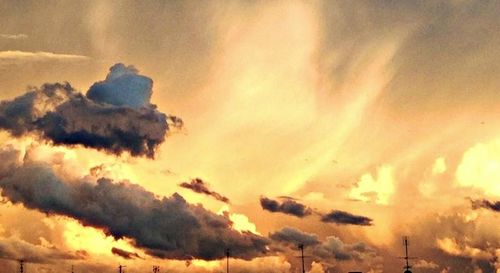 Low angle view of cloudy sky at sunset
