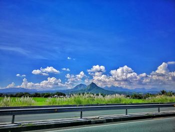 Scenic view of mountains against blue sky