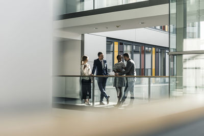 Business people talking on office floor