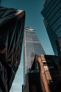 Low angle view of modern buildings against sky