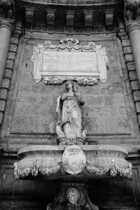 Low angle view of statue against temple