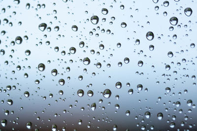 Full frame shot of wet window in rainy season