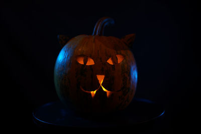 Close-up of jack o lantern against black background
