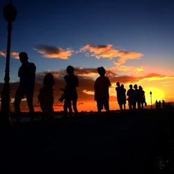 Silhouette people at sunset