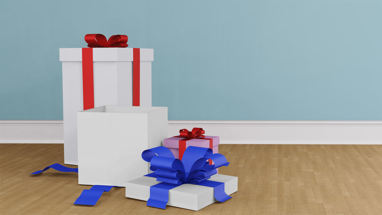 CLOSE-UP OF RED BOX ON HARDWOOD FLOOR AGAINST WALL