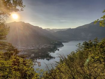 Scenic view of lake and mountains against sky