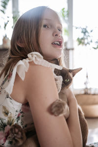 Portrait of young woman looking away