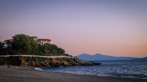 Scenic view of sea against clear sky during sunset