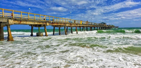 Pier over sea against sky