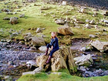 Portrait of a man sitting on rock