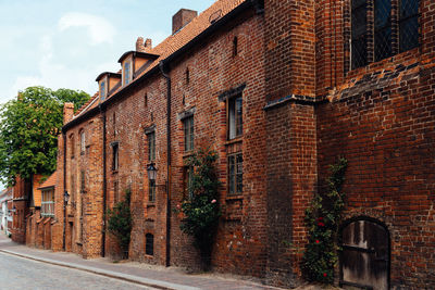 Old brick buildings in street in historic centre on wismar