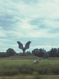 Horse on field against sky