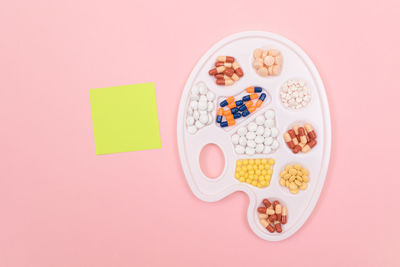 Directly above shot of multi colored candies on table
