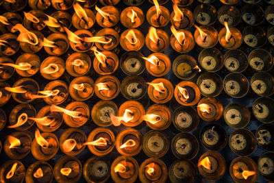 Full frame shot of illuminated candles