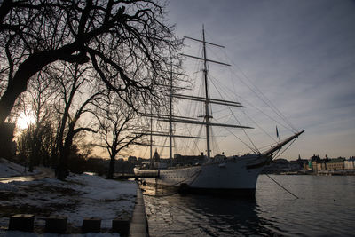 Nautical vessel on sea against sky during sunset