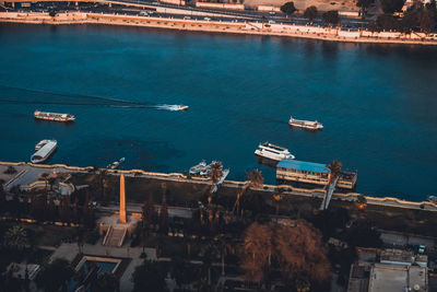 High angle view of commercial dock by sea against sky