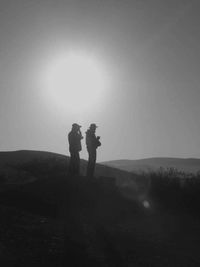 Silhouette of woman on landscape