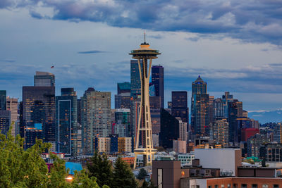 Modern buildings in city against sky