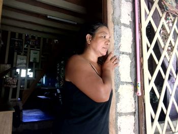 Beautiful young woman looking away