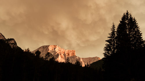 Amazing magic light phenomena where the last rays of light raises upon the italian dolomites.