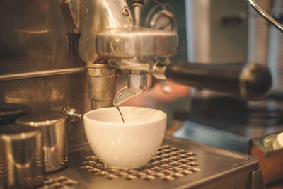 Close-up of pouring coffee in kitchen