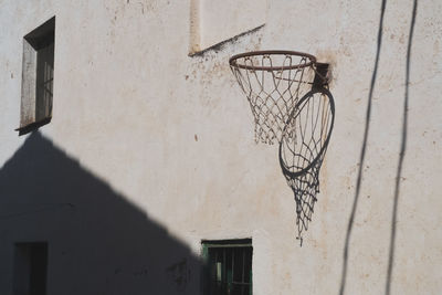 Low angle view of basketball hoop against building