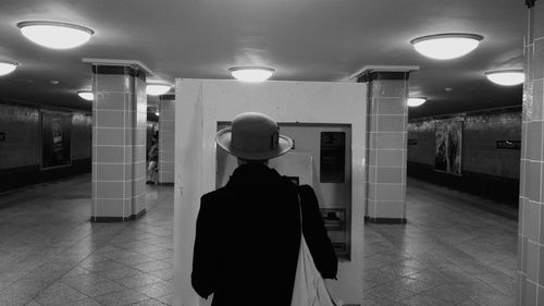 Silhouette of woman standing in corridor