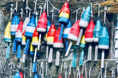 Colorful buoys handing on railing