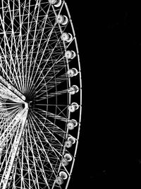 Low angle view of ferris wheel against sky at night