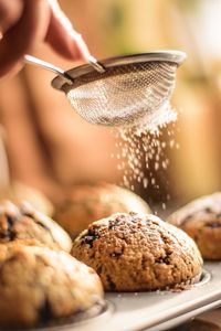 Powdered sugar falling on cookies