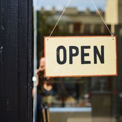 Close-up of open text on door