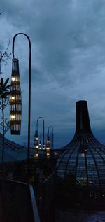 Illuminated bridge against sky at dusk