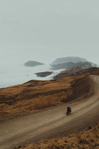 Road through the mountains and clouds