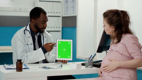 Doctor examining patient at clinic