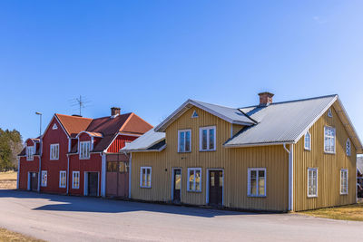 Built structures against clear blue sky