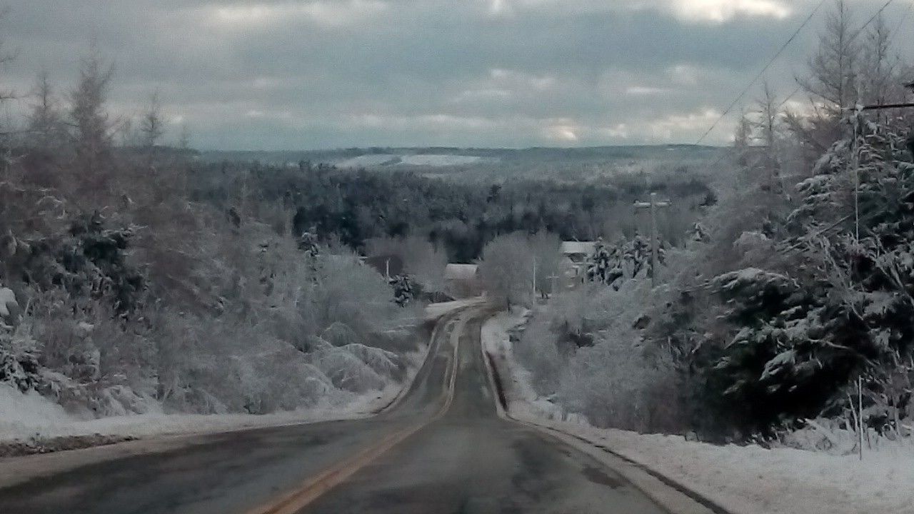 snow, landscape, sky, road, weather, season, the way forward, cloud - sky, nature, tranquil scene, tranquility, scenics, beauty in nature, covering, non-urban scene, diminishing perspective, cloud, no people, vanishing point, country road, outdoors, day, cloudy, remote, mountain, non urban scene