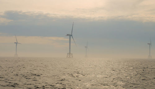 Wind farm offshore energy wind turbine construction on the north sea