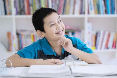 Boy studying at table