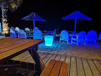 Chairs and tables on table at beach