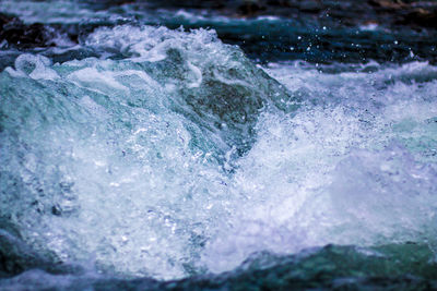 Close-up of water splashing in sea