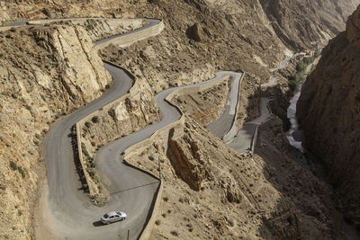 High angle view of winding road on sand