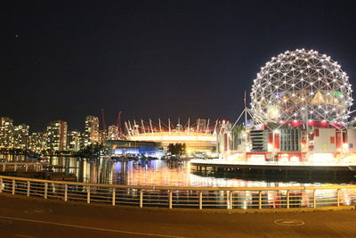 Ferris wheel in city at night