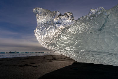 Scenic view of sea against sky during winter