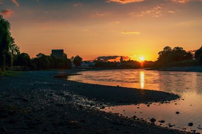 Scenic view of beach against sky during sunset