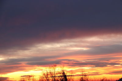 Low angle view of dramatic sky during sunset