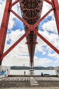 View of bridge against cloudy sky