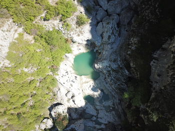 High angle view of rocks by sea