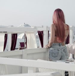 Close-up of woman standing by railing