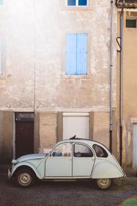 Vintage car against building